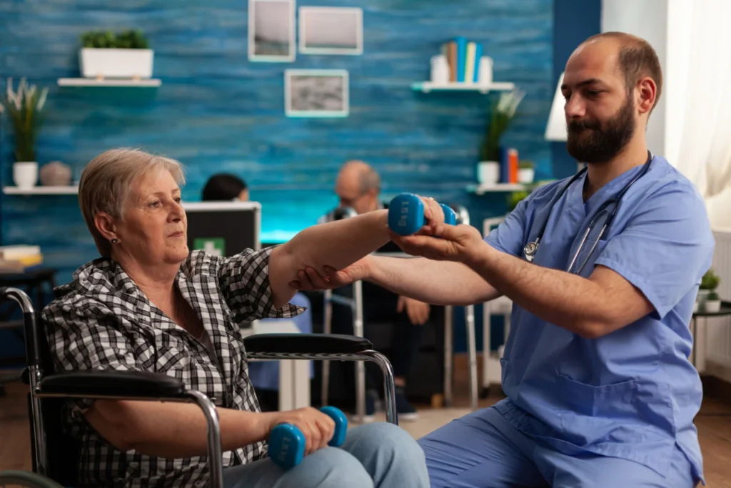 Older woman sitting down doing physiotherapy